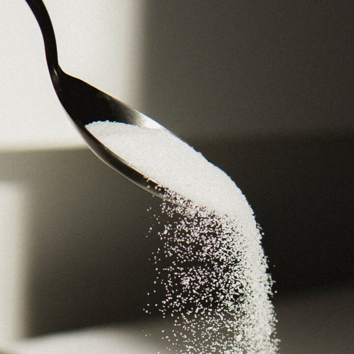 sweetener being poured from spoon