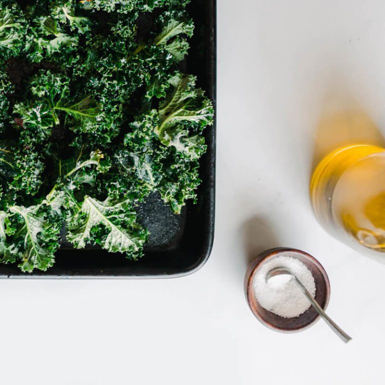 Photo of cooking oil, salt, and kale