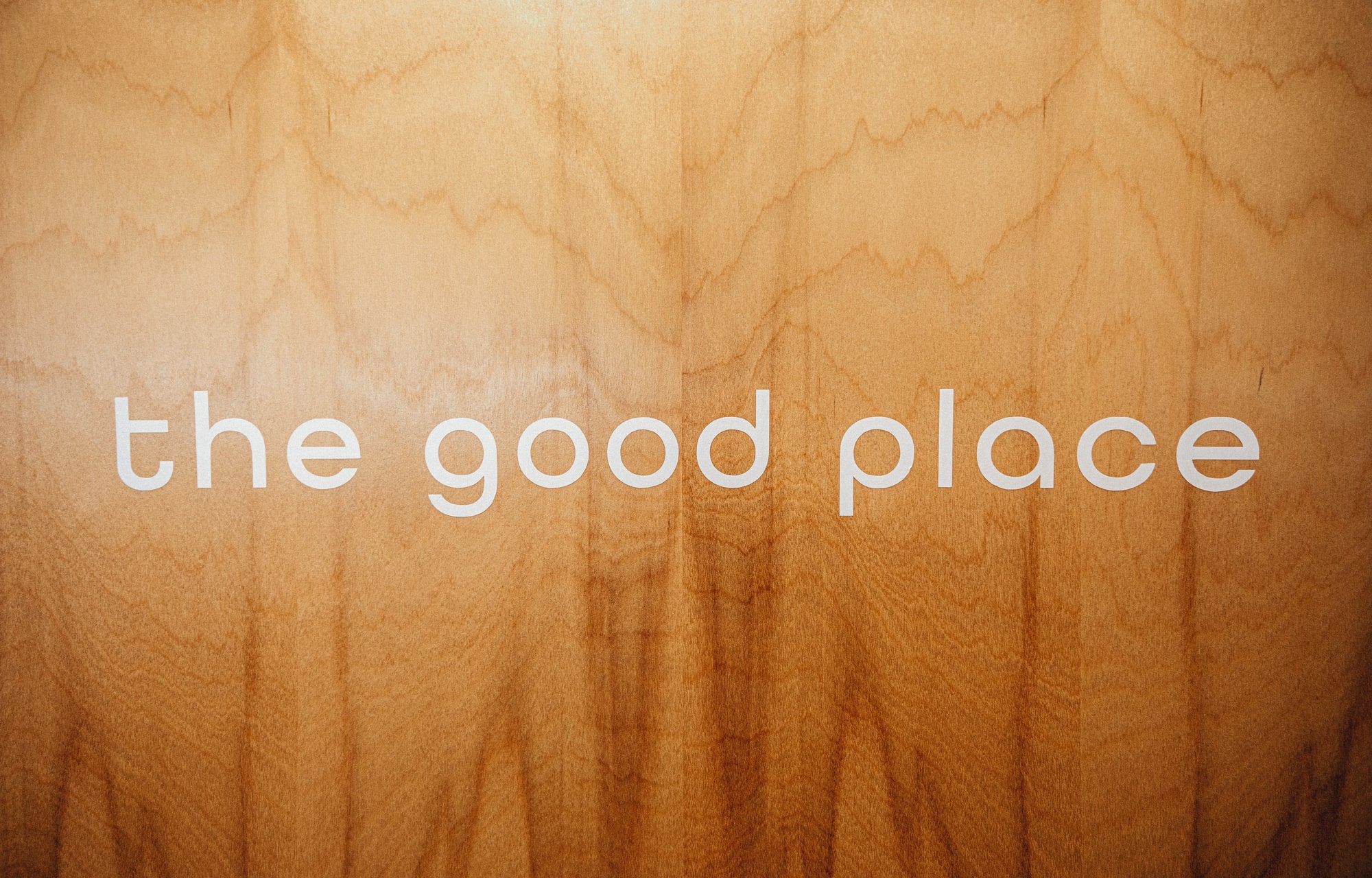 the good place signage on office door